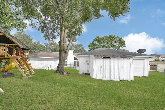 15702 Congo Ln, Jersey Village, TX 77040 - view of yard featuring a playground and a garage