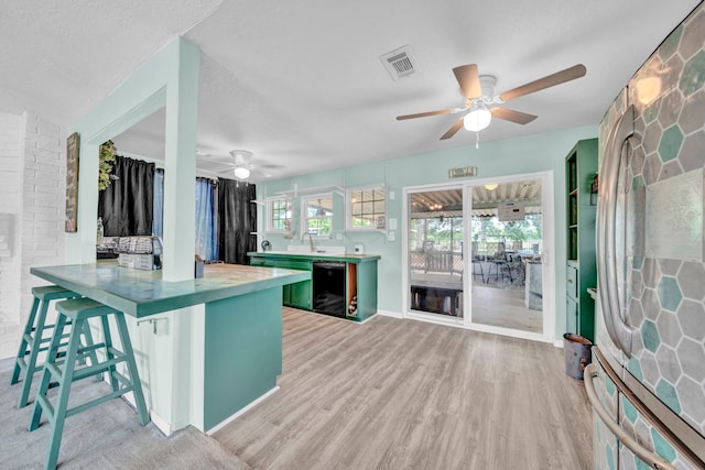 40670 Jozwiak Ln, Hempstead, TX 77445 - kitchen featuring ceiling fan, black dishwasher, and light wood-style flooring