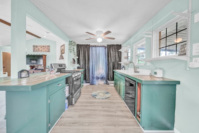 40670 Jozwiak Ln, Hempstead, TX 77445 - kitchen with stainless steel range with gas cooktop, dishwasher, blue cabinetry, light wood-style floors, and ceiling fan