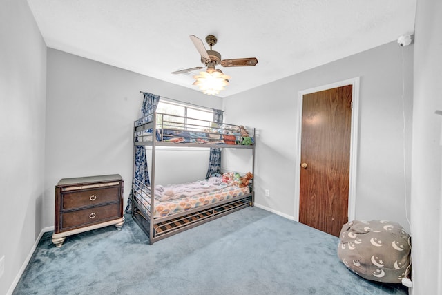 40670 Jozwiak Ln, Hempstead, TX 77445 - carpeted bedroom with baseboards and ceiling fan