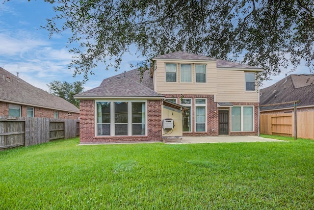 6103 Timbermoss Ct, League City, TX 77573 - back of property featuring brick siding, a patio, a fenced backyard, and roof with shingles