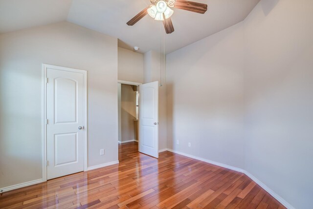 6103 Timbermoss Ct, League City, TX 77573 - unfurnished bedroom featuring light wood finished floors, ceiling fan, and high vaulted ceiling