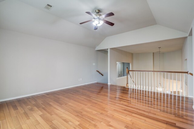 6103 Timbermoss Ct, League City, TX 77573 - empty room featuring a ceiling fan, wood finished floors, and vaulted ceiling