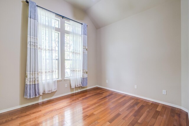 6103 Timbermoss Ct, League City, TX 77573 - spare room featuring healthy amount of natural light, wood-type flooring, and lofted ceiling
