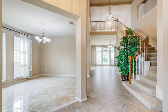 6103 Timbermoss Ct, League City, TX 77573 - entryway with a chandelier, ceiling fan, stairway, and a high ceiling