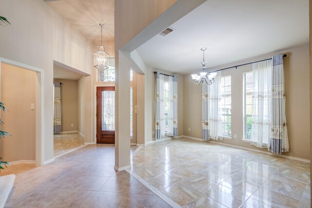 6103 Timbermoss Ct, League City, TX 77573 - foyer featuring a chandelier and baseboards