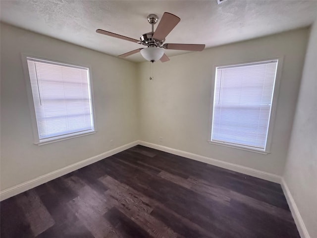 10124 Homestead Rd, Houston, TX 77016 - spare room with dark wood finished floors and a ceiling fan
