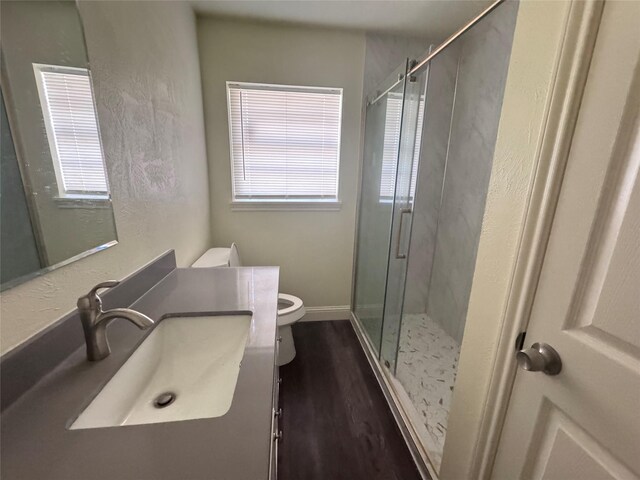 10124 Homestead Rd, Houston, TX 77016 - full bath with vanity, a stall shower, and wood finished floors
