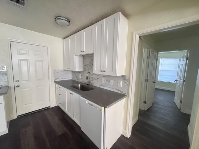 10124 Homestead Rd, Houston, TX 77016 - kitchen with white dishwasher, dark wood-style floors, and white cabinets