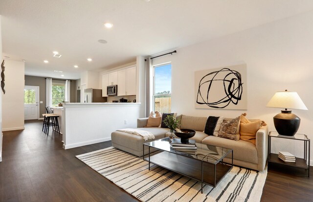 16415 Windy Cove Ct, Conroe, TX 77302 - living room with dark wood-style floors and recessed lighting