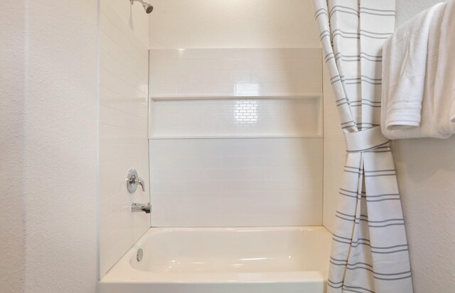 16415 Windy Cove Ct, Conroe, TX 77302 - bathroom with shower / bath combo and a textured wall