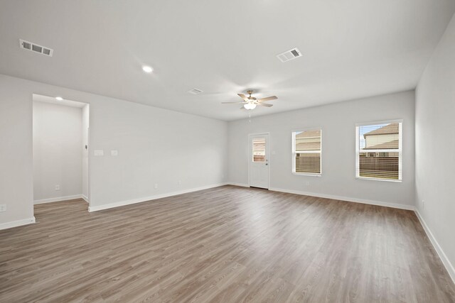 10713 Blocker Ct, Bryan, TX 77801 - spare room with ceiling fan, plenty of natural light, and wood finished floors