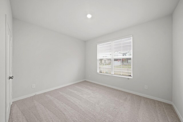 10713 Blocker Ct, Bryan, TX 77801 - empty room featuring light carpet and recessed lighting