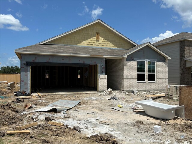10713 Blocker Ct, Bryan, TX 77801 - property in mid-construction with a garage, brick siding, and driveway