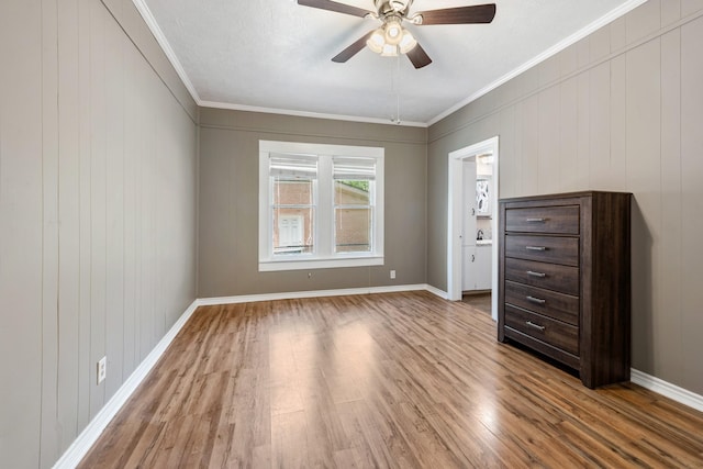 701 W Fawn St, Caldwell, TX 77836 - empty room featuring wood finished floors, ceiling fan, and crown molding