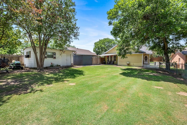 701 W Fawn St, Caldwell, TX 77836 - fenced backyard with an outdoor structure