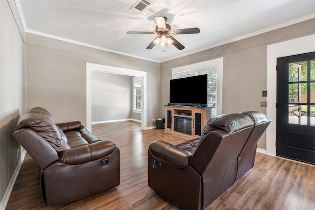 701 W Fawn St, Caldwell, TX 77836 - living room with crown molding, ceiling fan, and wood finished floors