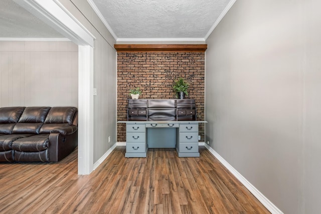 701 W Fawn St, Caldwell, TX 77836 - office area with wood finished floors, a textured ceiling, and crown molding