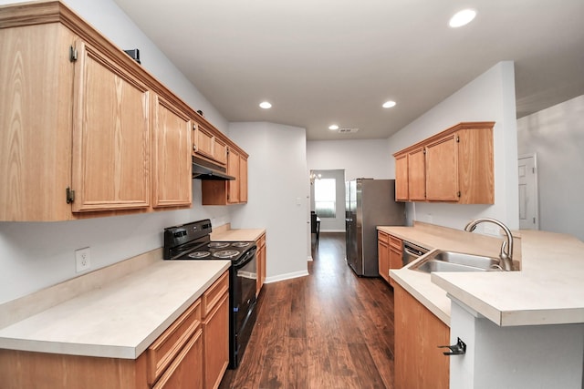 8030 Grow Ln, Houston, TX 77040 - kitchen with stainless steel appliances, a peninsula, under cabinet range hood, dark wood finished floors, and light countertops