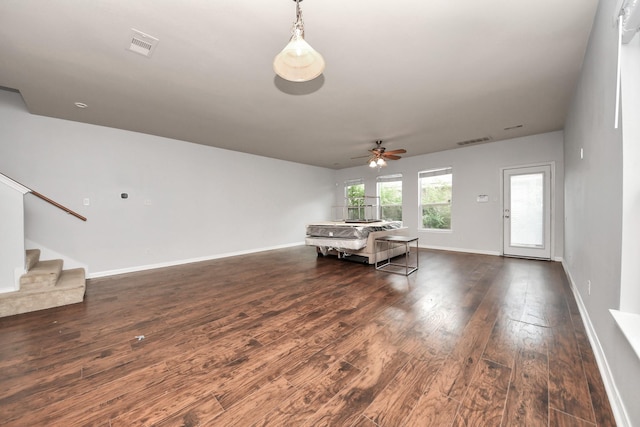 8030 Grow Ln, Houston, TX 77040 - living room featuring a ceiling fan, wood finished floors, and stairs
