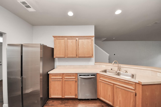8030 Grow Ln, Houston, TX 77040 - kitchen with appliances with stainless steel finishes, a peninsula, light countertops, dark wood-style flooring, and recessed lighting
