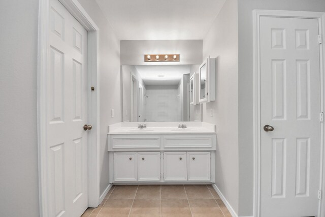 8030 Grow Ln, Houston, TX 77040 - full bathroom featuring double vanity and tile patterned floors