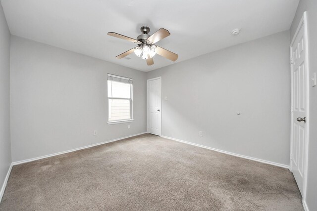 8030 Grow Ln, Houston, TX 77040 - unfurnished room featuring ceiling fan, carpet, and a smoke detector