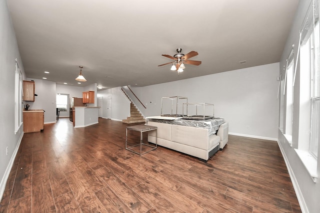 8030 Grow Ln, Houston, TX 77040 - living room with ceiling fan, dark wood-style flooring, stairway, and recessed lighting
