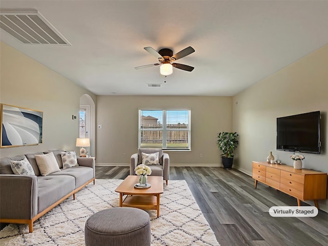 8839 Hazel Rose Sky Dr, Humble, TX 77338 - living area with a ceiling fan, wood finished floors, and arched walkways