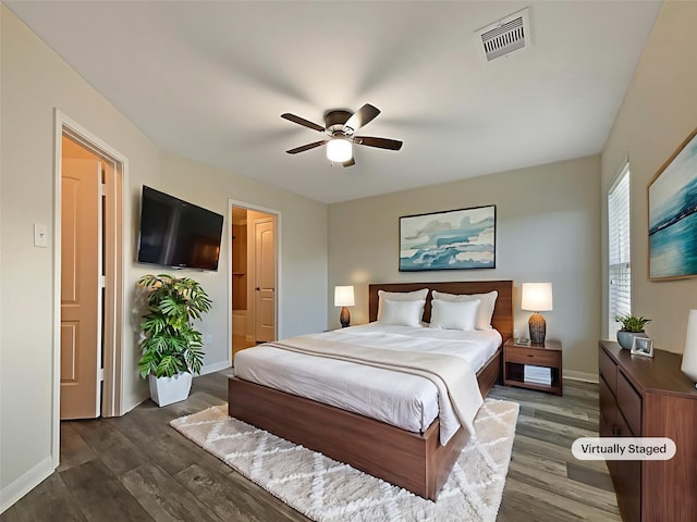 8839 Hazel Rose Sky Dr, Humble, TX 77338 - bedroom featuring dark wood-style flooring and a ceiling fan