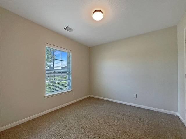 8839 Hazel Rose Sky Dr, Humble, TX 77338 - empty room featuring baseboards and carpet floors