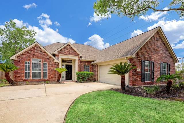 9847 Bestin Ln, Houston, TX 77065 - traditional home with brick siding, a shingled roof, driveway, and a garage