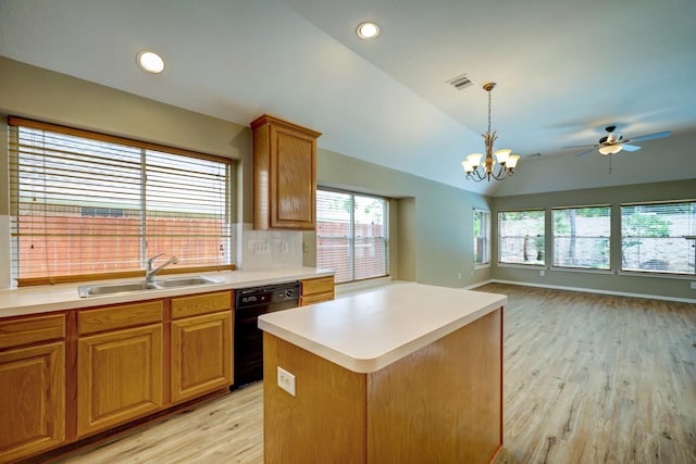 9847 Bestin Ln, Houston, TX 77065 - kitchen featuring black dishwasher, light wood-style floors, lofted ceiling, ceiling fan, and light countertops