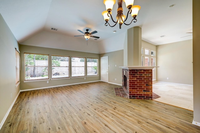 9847 Bestin Ln, Houston, TX 77065 - unfurnished living room featuring healthy amount of natural light, vaulted ceiling, ceiling fan, and wood finished floors
