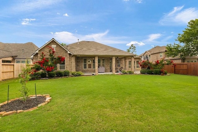 13839 Oak Fair Bnd, Cypress, TX 77429 - rear view of house featuring a fenced backyard and brick siding