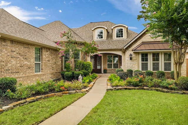 13839 Oak Fair Bnd, Cypress, TX 77429 - view of front facade with a front lawn, brick siding, a shingled roof, and stone siding