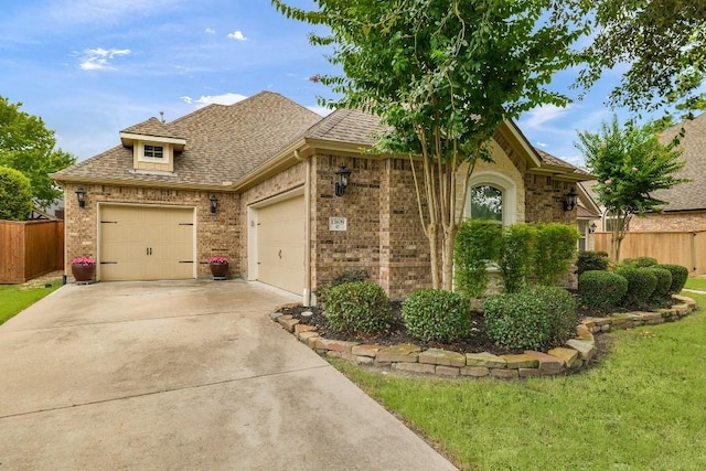 13839 Oak Fair Bnd, Cypress, TX 77429 - view of front facade featuring brick siding, concrete driveway, a garage, and a shingled roof