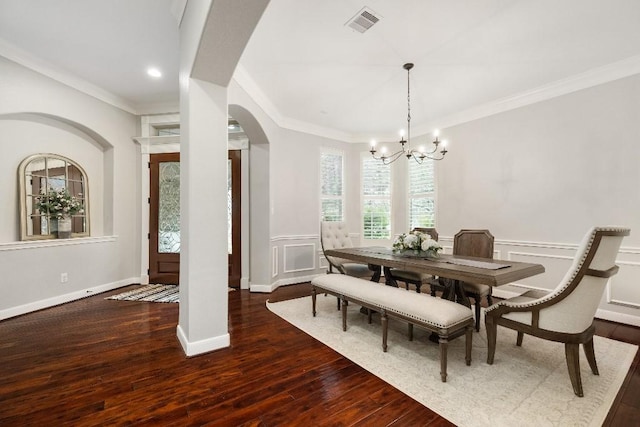 13839 Oak Fair Bnd, Cypress, TX 77429 - dining area featuring arched walkways, a chandelier, crown molding, wood-type flooring, and wainscoting