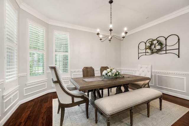 13839 Oak Fair Bnd, Cypress, TX 77429 - dining room with crown molding, wood finished floors, a chandelier, a decorative wall, and wainscoting