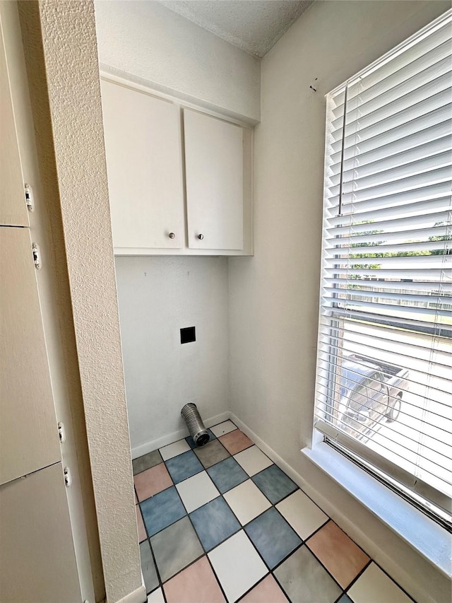 260 El Dorado Blvd Unit 2608, Houston, TX 77598 - laundry room featuring cabinet space and baseboards