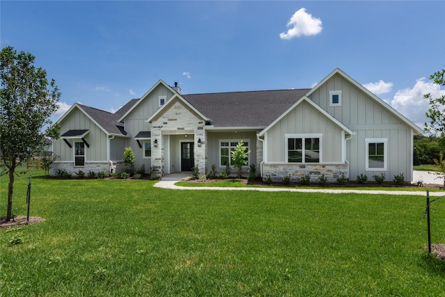 1430 Bluebonnet Ridge Dr, Chappell Hill, TX 77426 - modern farmhouse style home with board and batten siding, stone siding, a shingled roof, and a front yard