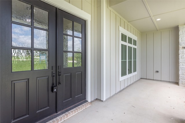 1430 Bluebonnet Ridge Dr, Chappell Hill, TX 77426 - property entrance featuring french doors and board and batten siding