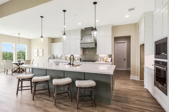 1430 Bluebonnet Ridge Dr, Chappell Hill, TX 77426 - kitchen featuring appliances with stainless steel finishes, custom range hood, backsplash, dark wood finished floors, and recessed lighting