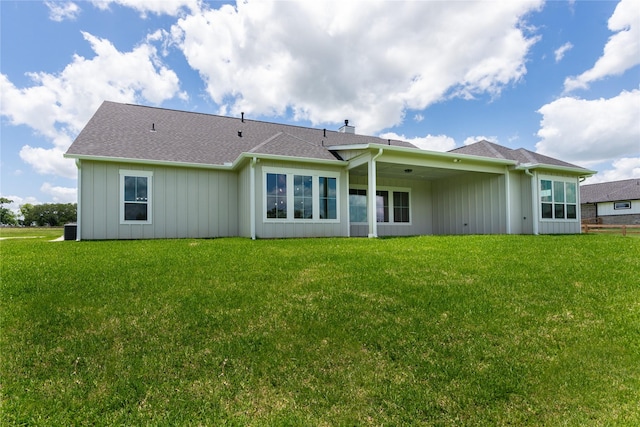 1430 Bluebonnet Ridge Dr, Chappell Hill, TX 77426 - rear view of house featuring board and batten siding, a yard, and roof with shingles