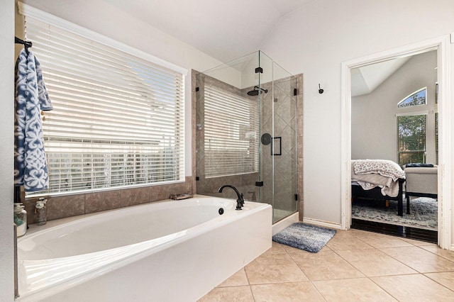 14730 Yellow Begonia Dr, Cypress, TX 77433 - bathroom featuring a garden tub, connected bathroom, vaulted ceiling, a shower stall, and tile patterned floors