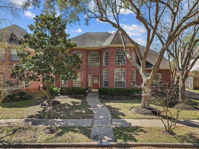 1410 Juniper Ln, Seabrook, TX 77586 - colonial-style house featuring brick siding and a shingled roof