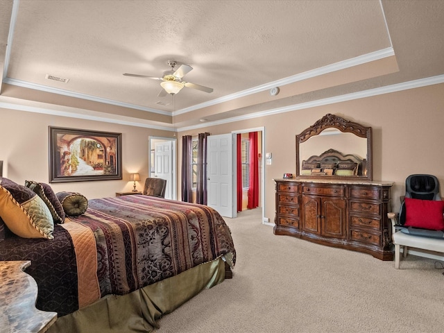 1410 Juniper Ln, Seabrook, TX 77586 - carpeted bedroom with a raised ceiling, crown molding, a textured ceiling, and a ceiling fan