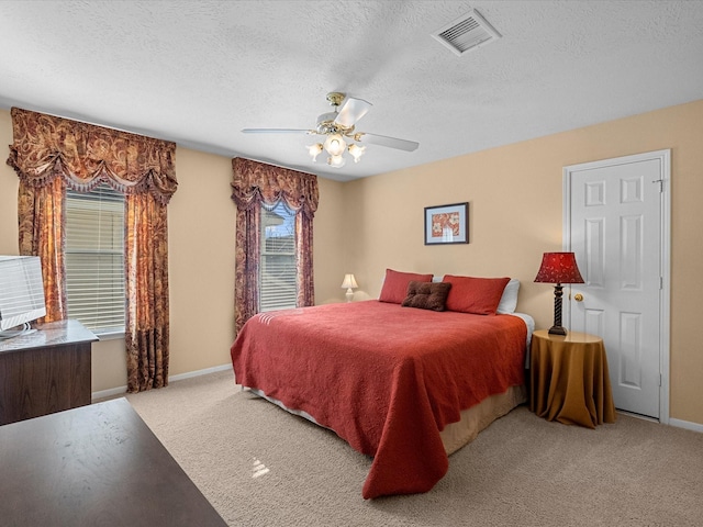 1410 Juniper Ln, Seabrook, TX 77586 - bedroom with carpet flooring, a textured ceiling, and ceiling fan