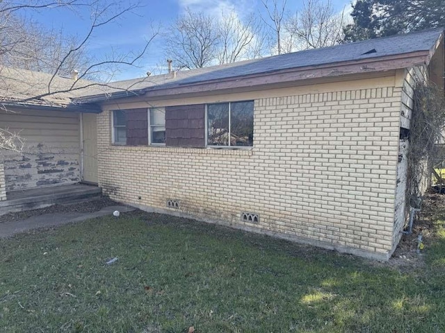 901 S 23rd St, Copperas Cove, TX 76522 - view of side of home with brick siding and a lawn