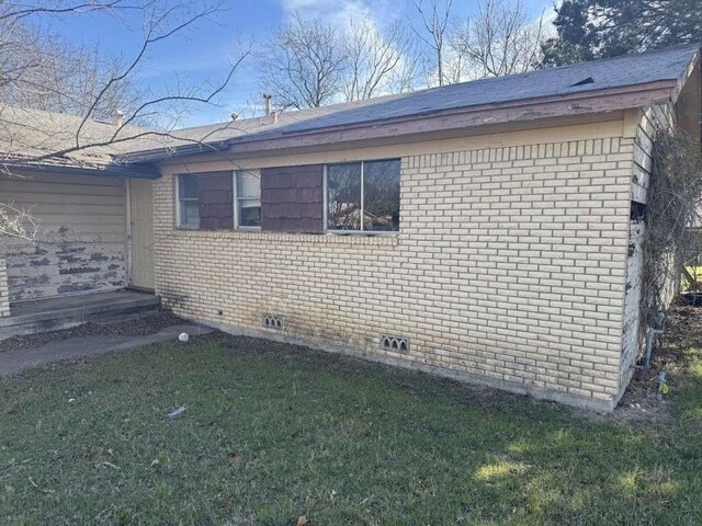 901 S 23rd St, Copperas Cove, TX 76522 - view of side of property featuring brick siding and a yard